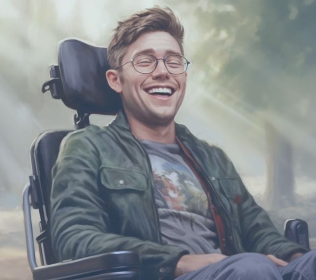 A man in a wheelchair at the park, wearing a graphic t-shirt and glasses laughing.