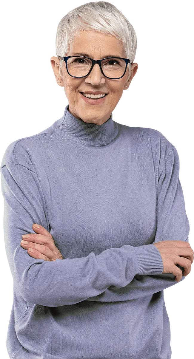 Woman with short grey hair and glasses, arms folded and smiling.