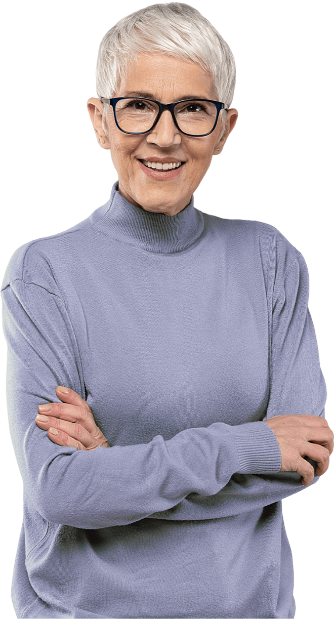 Woman with short grey hair and glasses, arms folded and smiling.