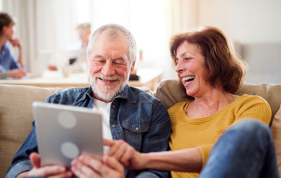 Senior Couple Shopping Medicare Plans iPad