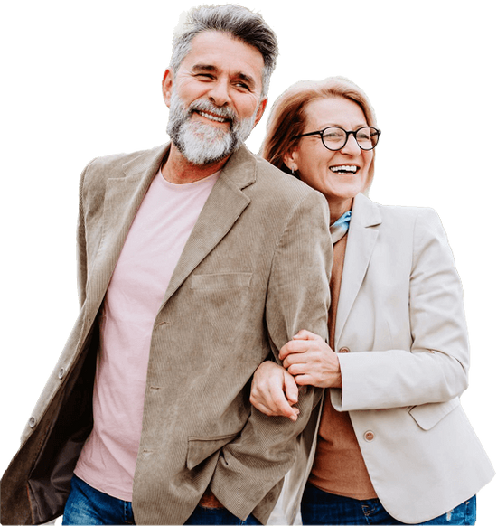 Mature couple standing together smiling.