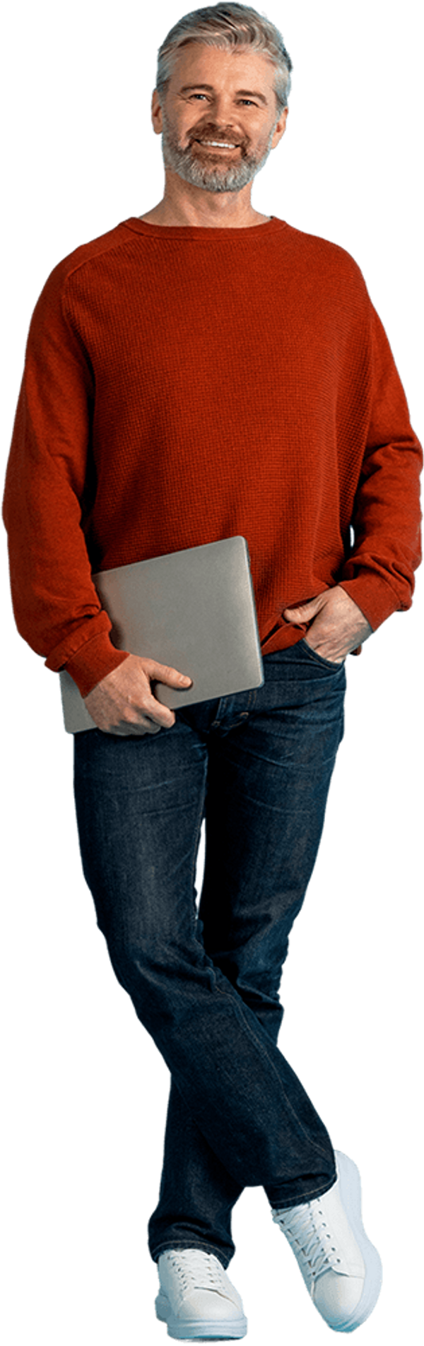 Bearded man in red sweater standing, holding a laptop.