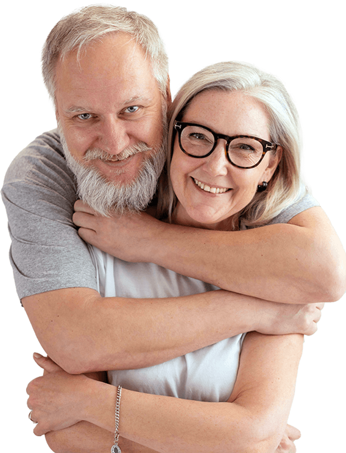 Elderly man with glasses and beard smiling.