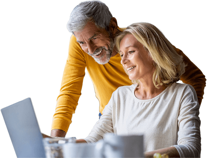 Couple Reading Medicare Definitions Laptop