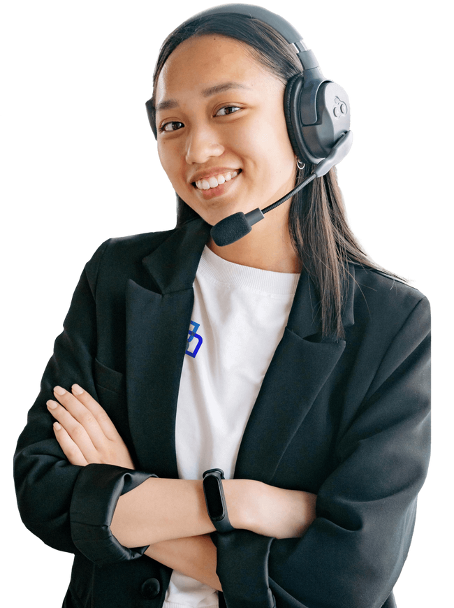 Healthpilot customer support agent wearing headphones and a logo t-shirt with jacket, smiling at the camera.