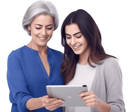 Mother and daughter smiling looking down at a tablet.