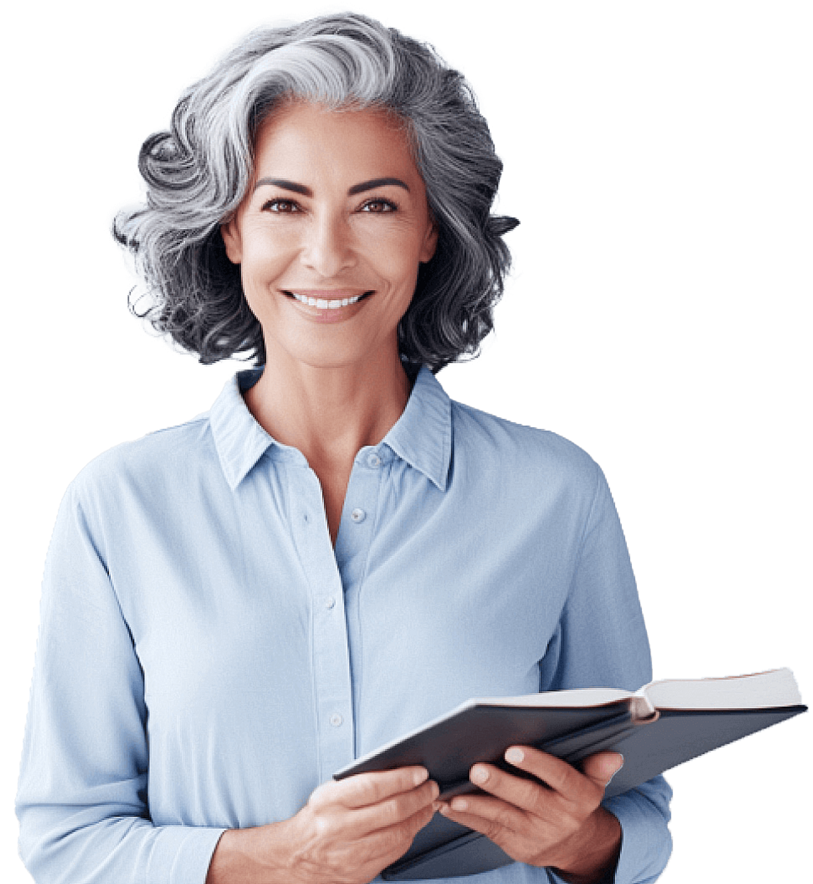 Beautiful grey haired woman in a blue button up shirt smiling holding a book.