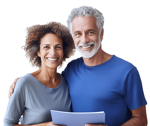 A couple smiling holding a stack of papers.