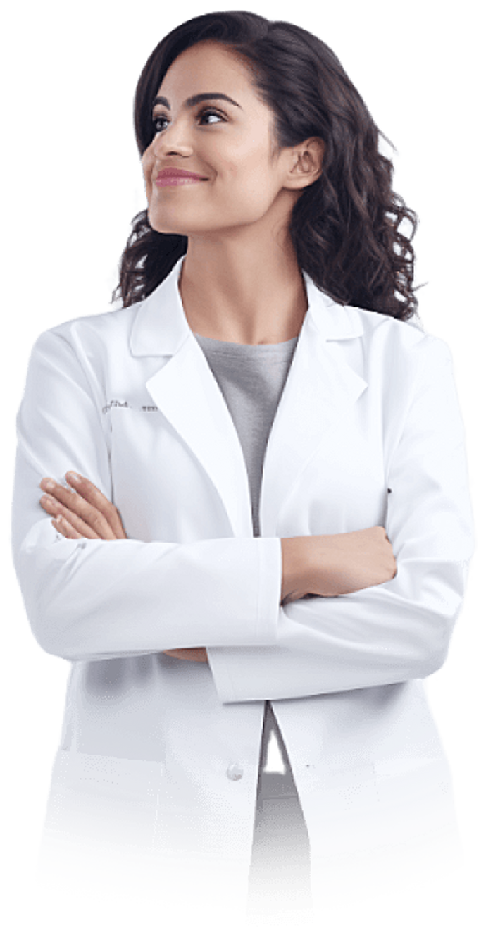 Young female doctor in lab coat looking left, smiling.