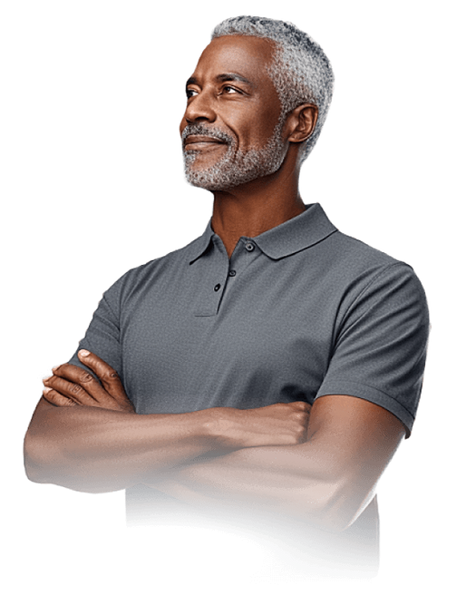 Attractive senior man in grey polo shirt with arms crossed, looking to the right smiling.