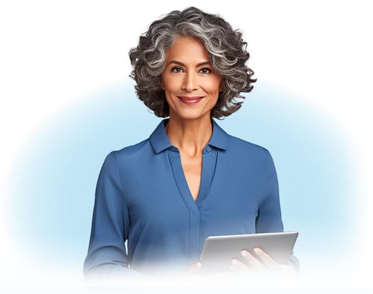 Sophisticated woman in blue button down shirt, smiling and holding a tablet.
