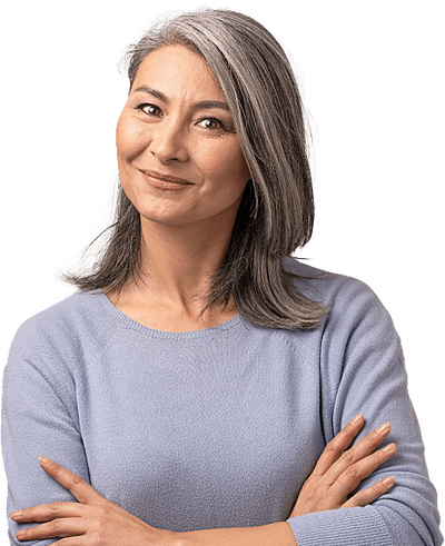 Professional woman in grey sweater smiling.