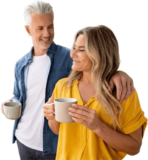 Mature Couple Smiling Holding Coffee